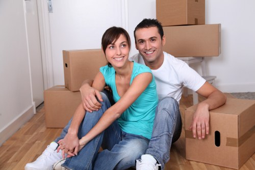 Packed boxes and furniture prepared for storage in Swiss Cottage