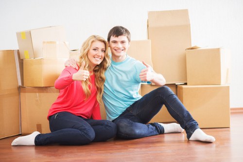 Packing boxes and loading a van for a move in Swiss Cottage