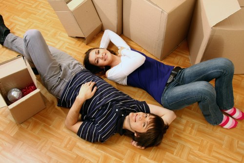 Packed moving boxes and furniture prepared for removal services in Swiss Cottage